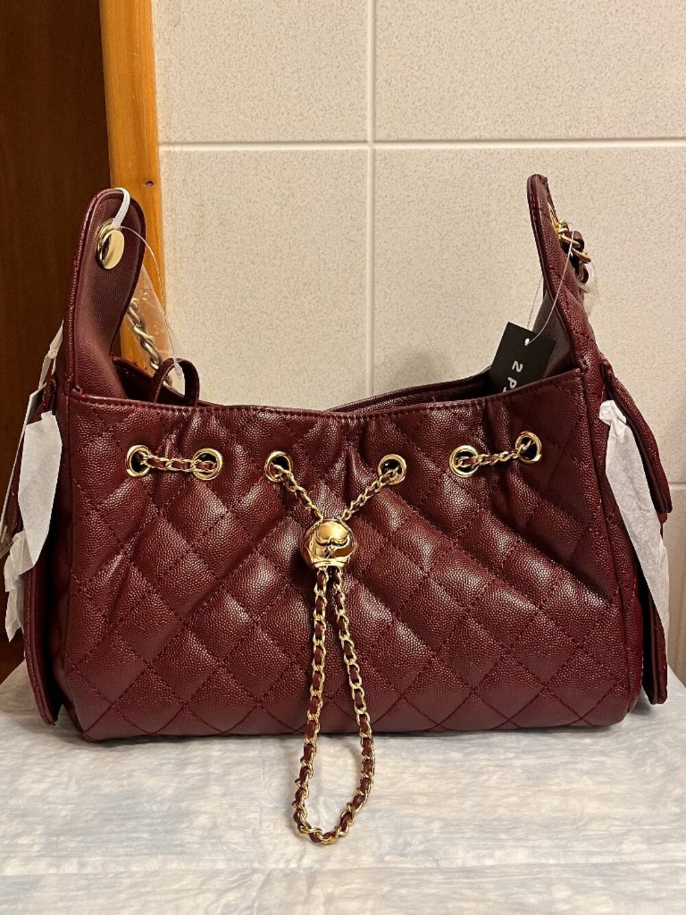 ELLO Alyssa "cc" Quilted Burgundy drawstring Shoulder Bag with Gold Chain Detail